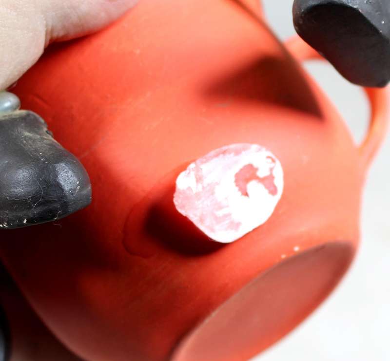 Ceramic cow in a cup