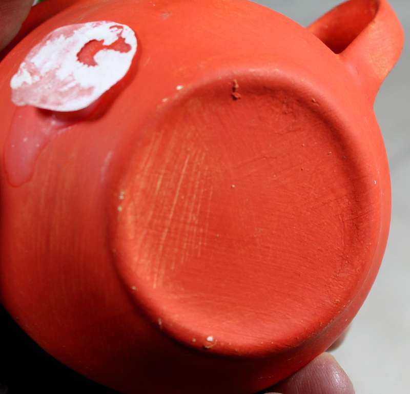 Ceramic cow in a cup