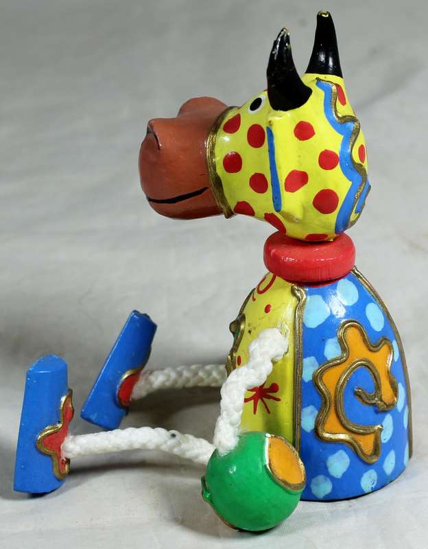 Seated funny wooden cow