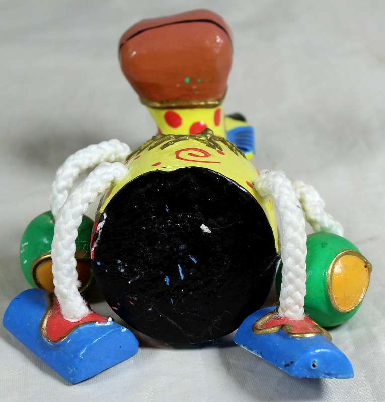 Seated funny wooden cow