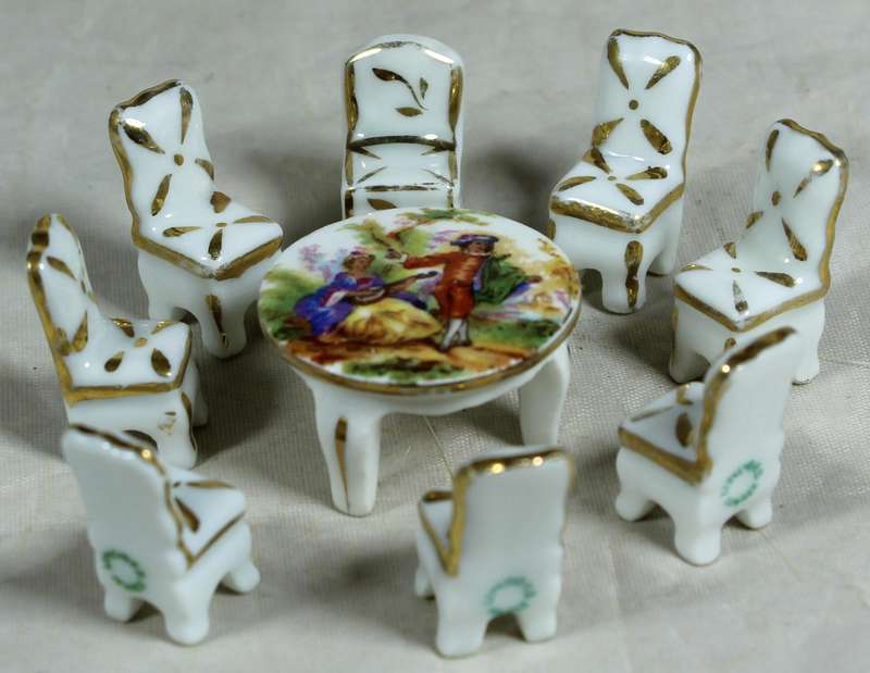Miniature Limoges table with eight chairs