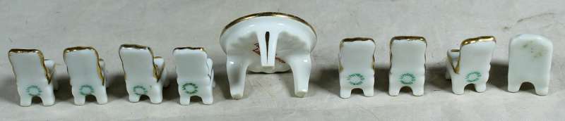 Miniature Limoges table with eight chairs