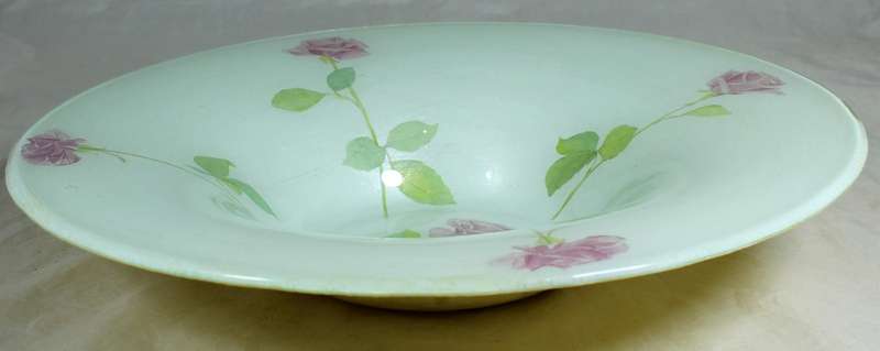 Glass center piece with roses motif