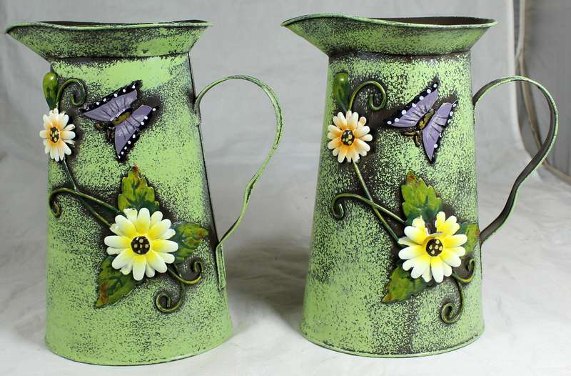 Pair of embossed tin jugs