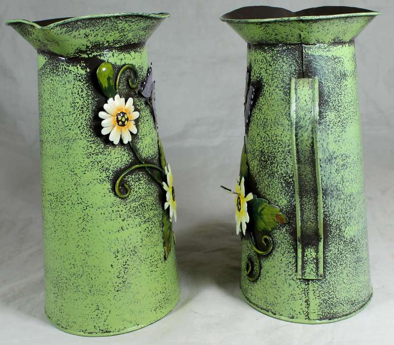 Pair of embossed tin jugs