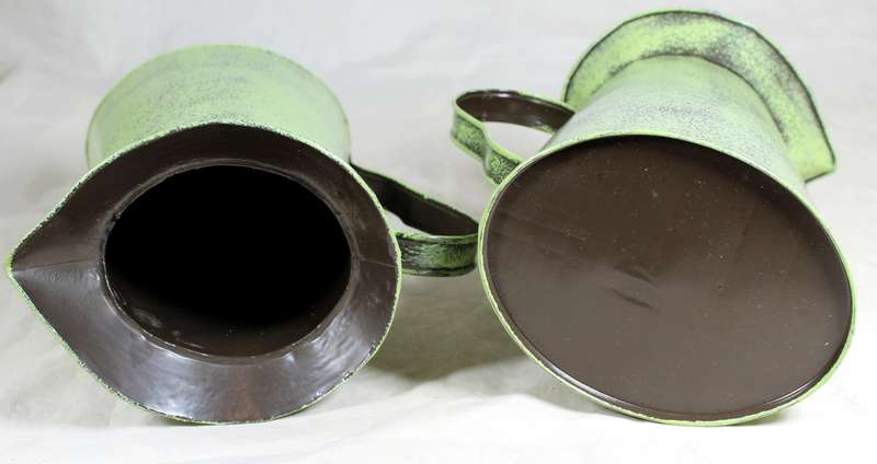 Pair of embossed tin jugs