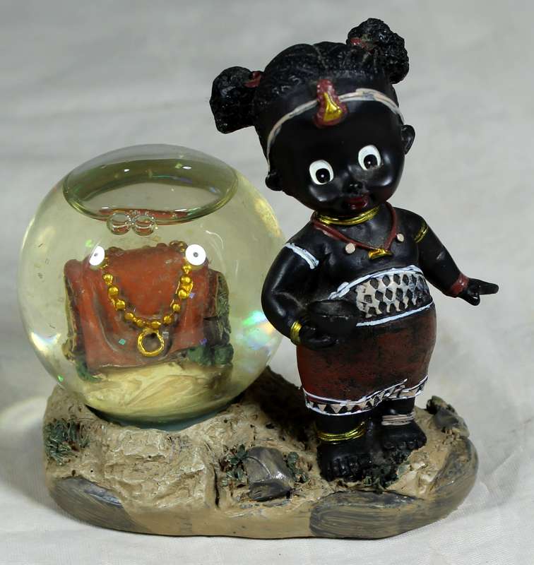 Little girl with snowglobe