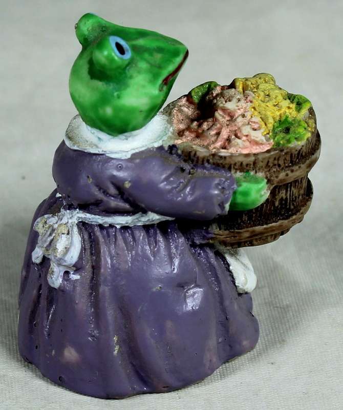 Miniature mamma frog with a bushel of flowers