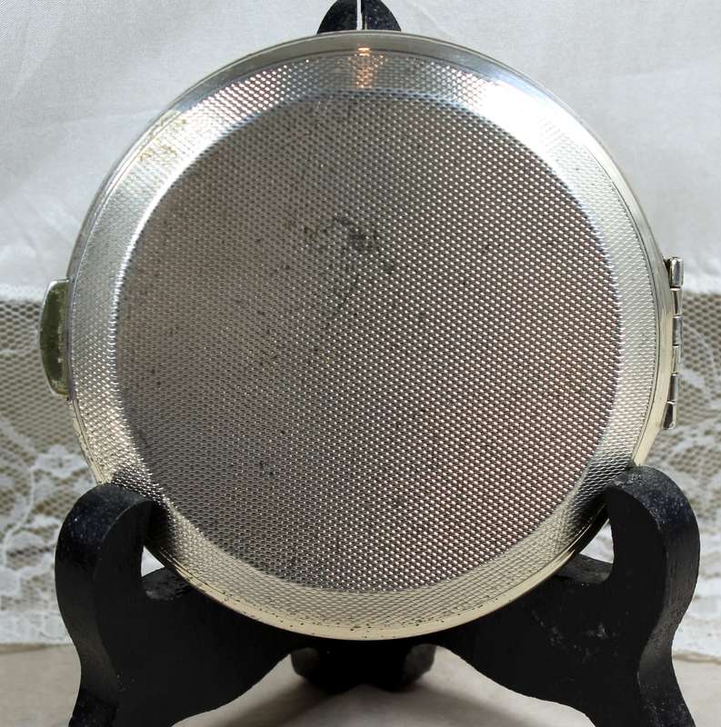 Compact mirror in pouch