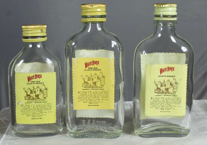 Empty liquor bottles - Trio of White Horse whisky