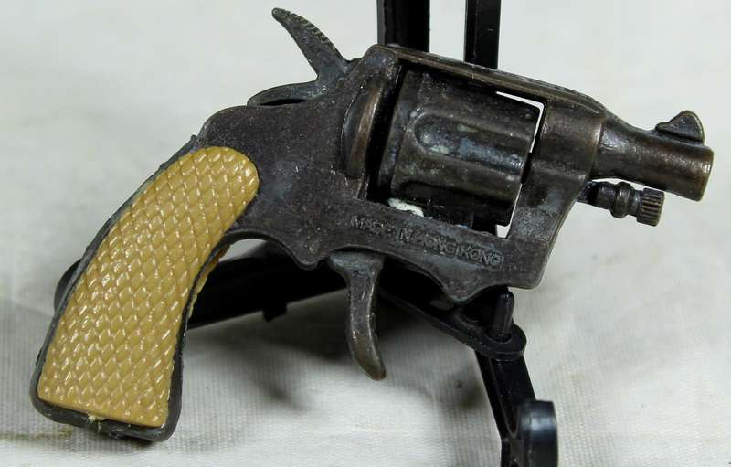 Miniature brass revolver with shooting mechanism