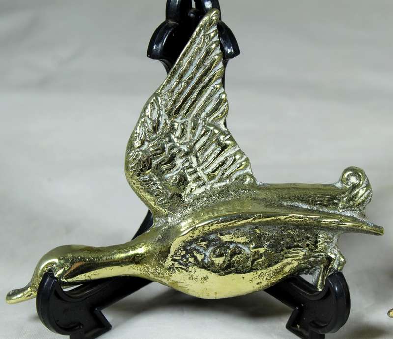 Trio of flying brass geese