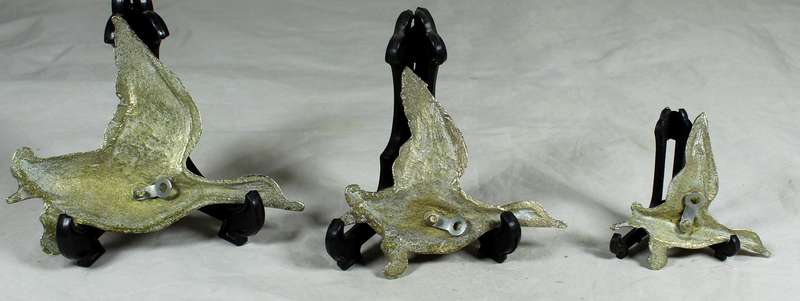 Trio of flying brass geese