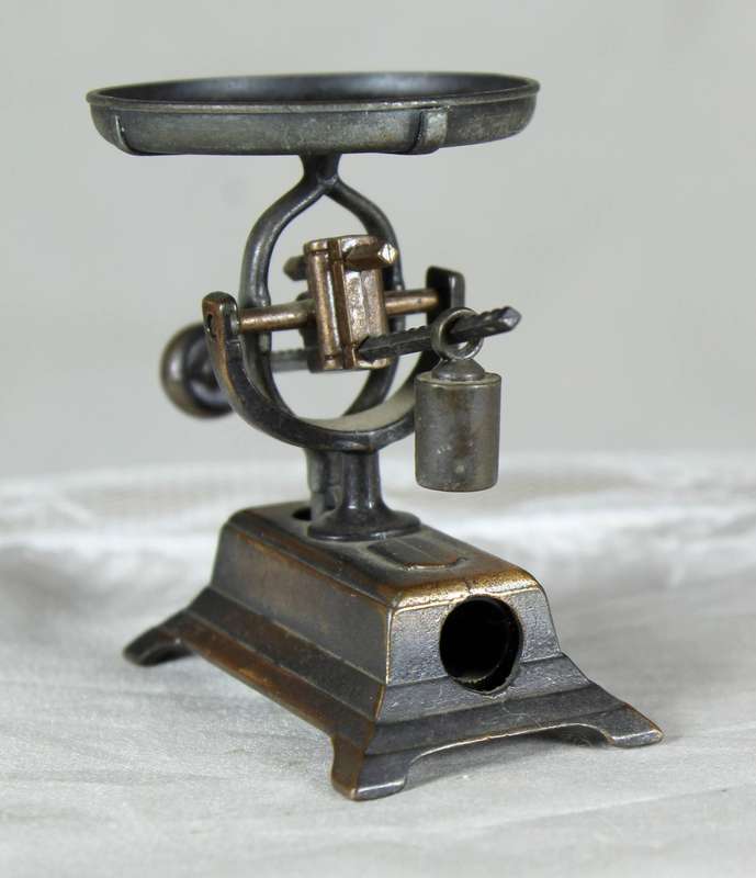 Miniature brass scale pencil sharpener