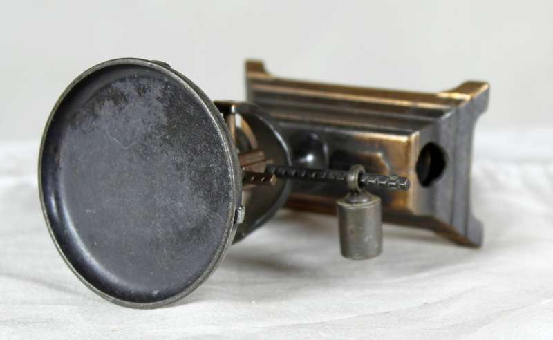 Miniature brass scale pencil sharpener