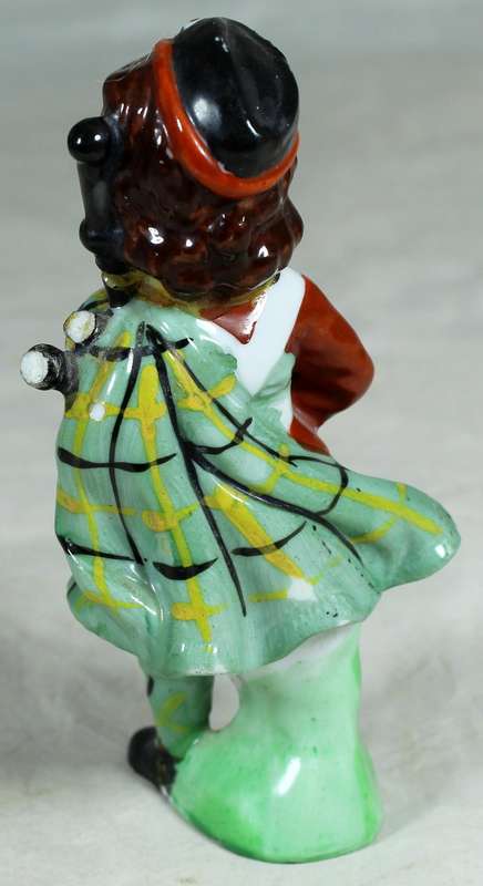 Girl ceramic bagpiper