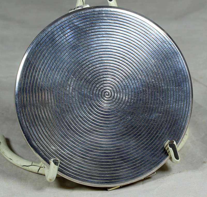 Large silver look powder compact with engraving