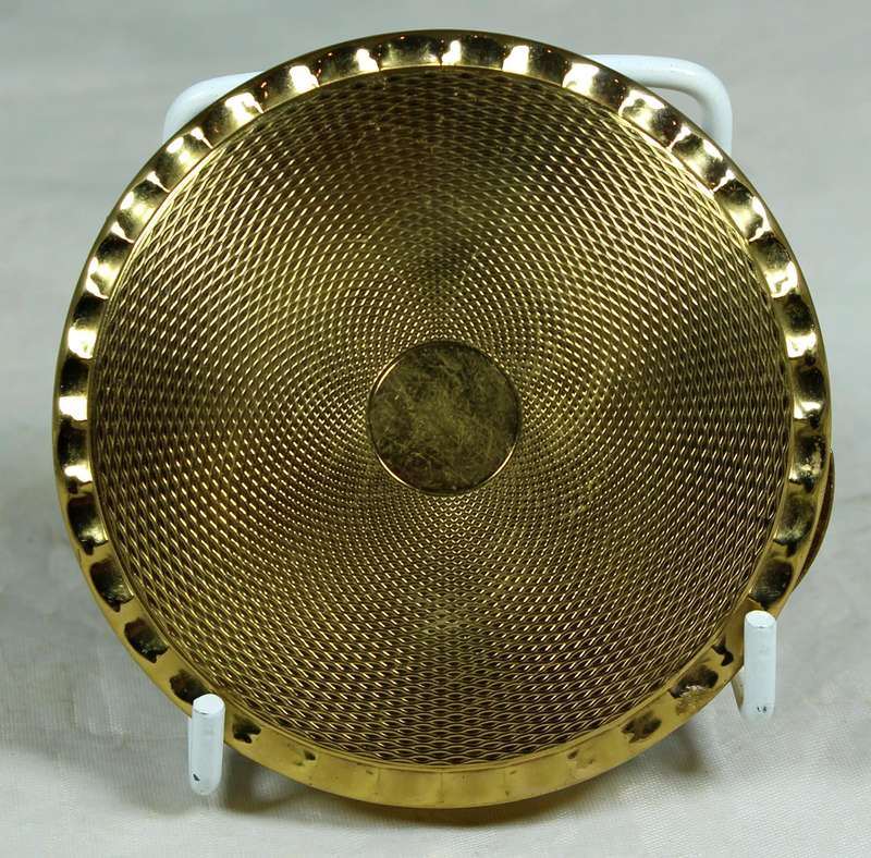 Gold tone powder compact
