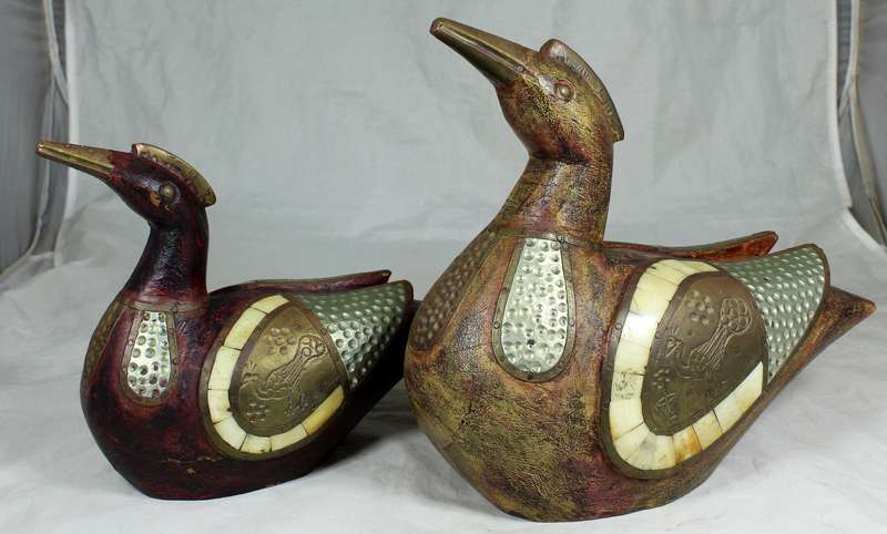 Pair of wooden ducks with metal inlay