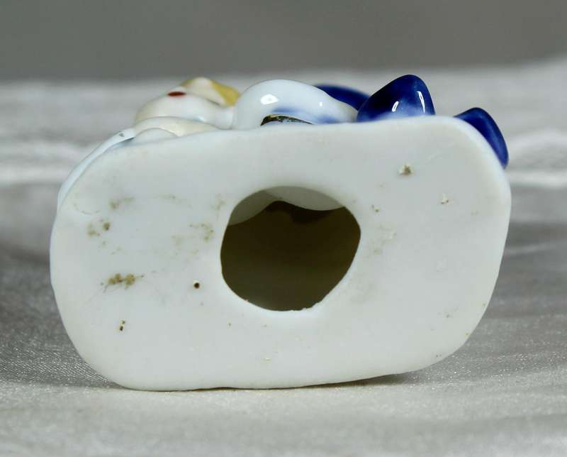 Miniature porcelain singing boy and girl