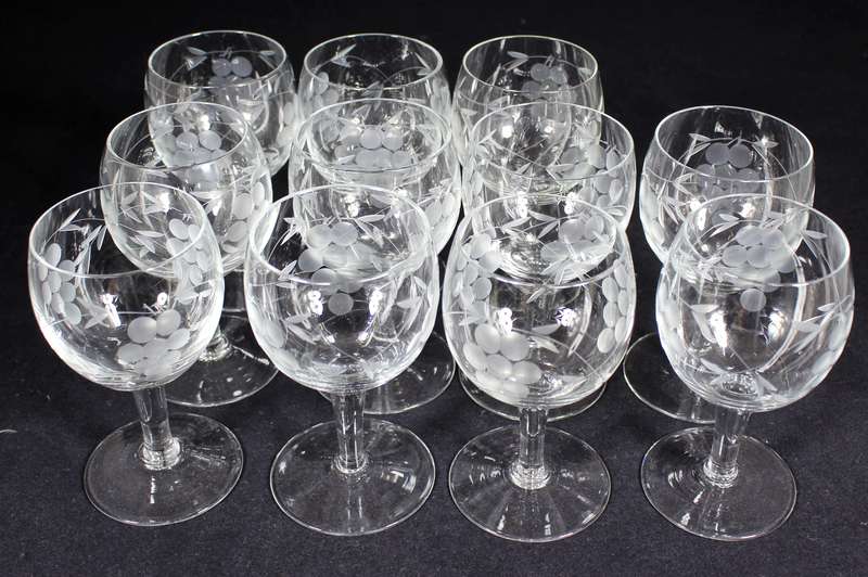 Set of eleven aperitif glasses with etched grapes motif