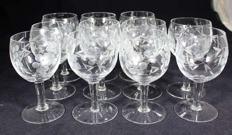 Set of eleven aperitif glasses with etched grapes motif