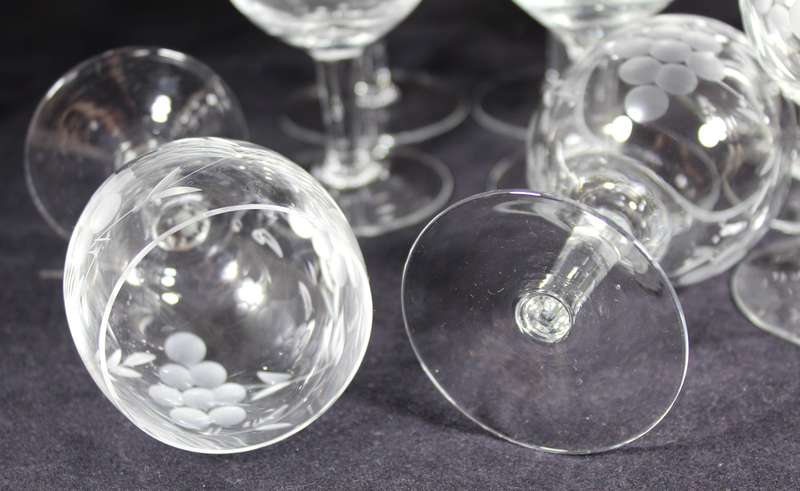 Set of eleven aperitif glasses with etched grapes motif