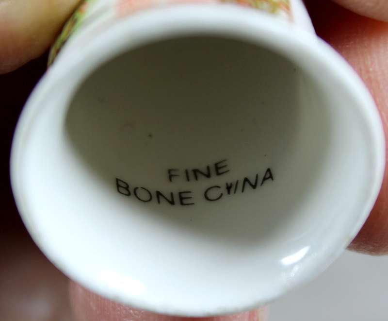 Bone China thimble - poster calendar 1897