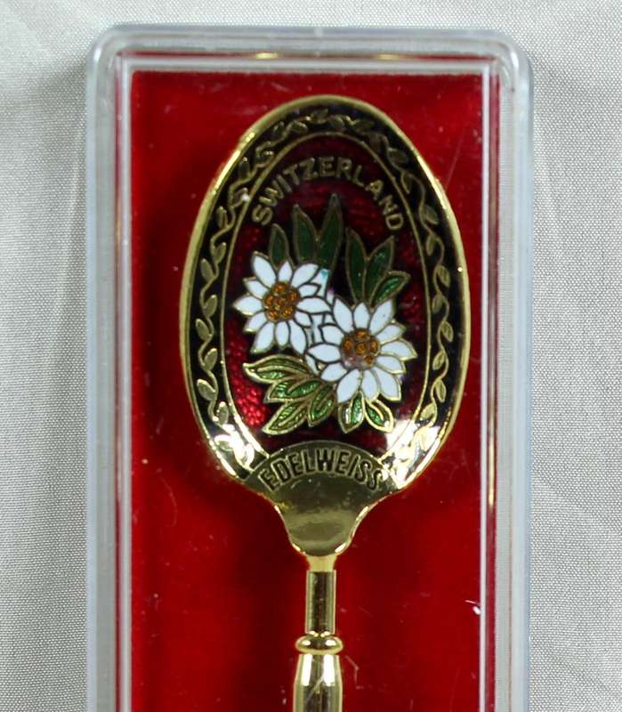 Souvenir spoon - Cloisonne with Edelweiss flower on red background