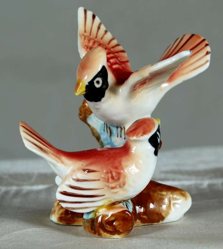 Miniature porcelain pair of birds on a stand