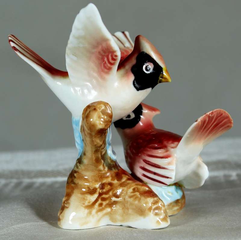 Miniature porcelain pair of birds on a stand