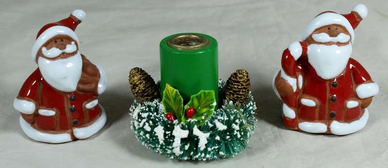Two Santa Clause plus Christmas candle holder