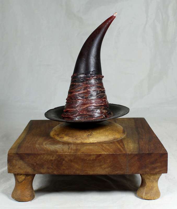 Witches candle on a wooden stand