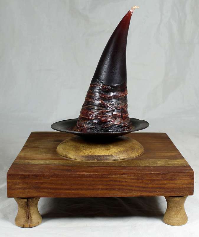 Witches candle on a wooden stand