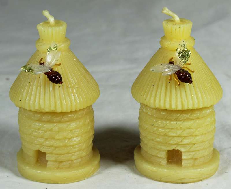 Pair of hut candles with bees