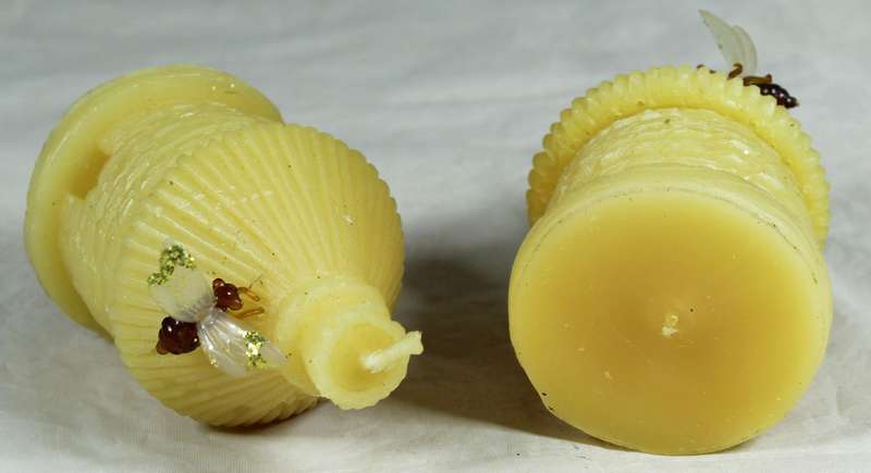 Pair of hut candles with bees