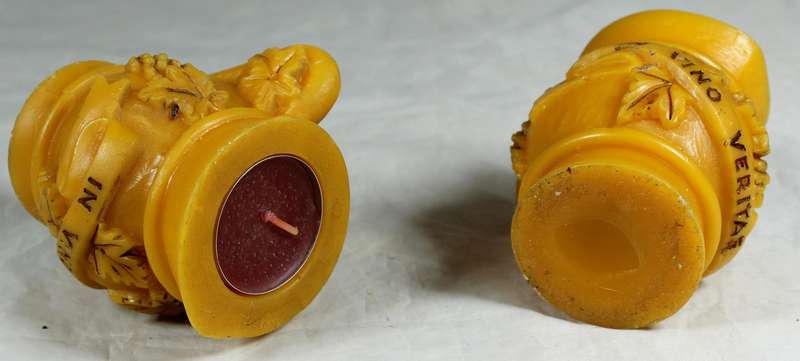 Pair of jug candles with inscription "In Vino Veritas"