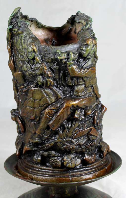 Highly detailed candle on a metal stand