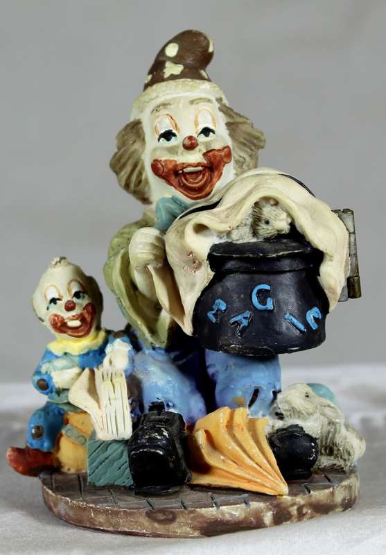 Ceramic clown with magic pot