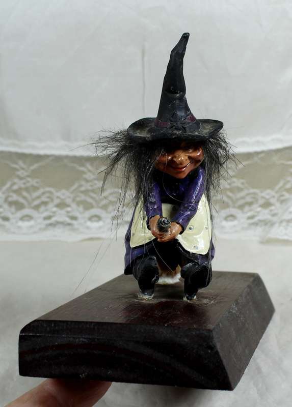 Witch riding a broom - small, on a wood plinth