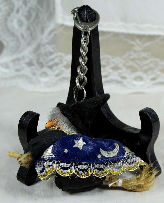 Witch in a blue dress riding a broom - keyring