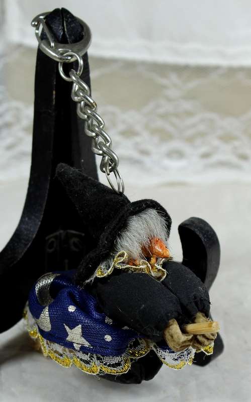 Witch in a blue dress riding a broom - keyring