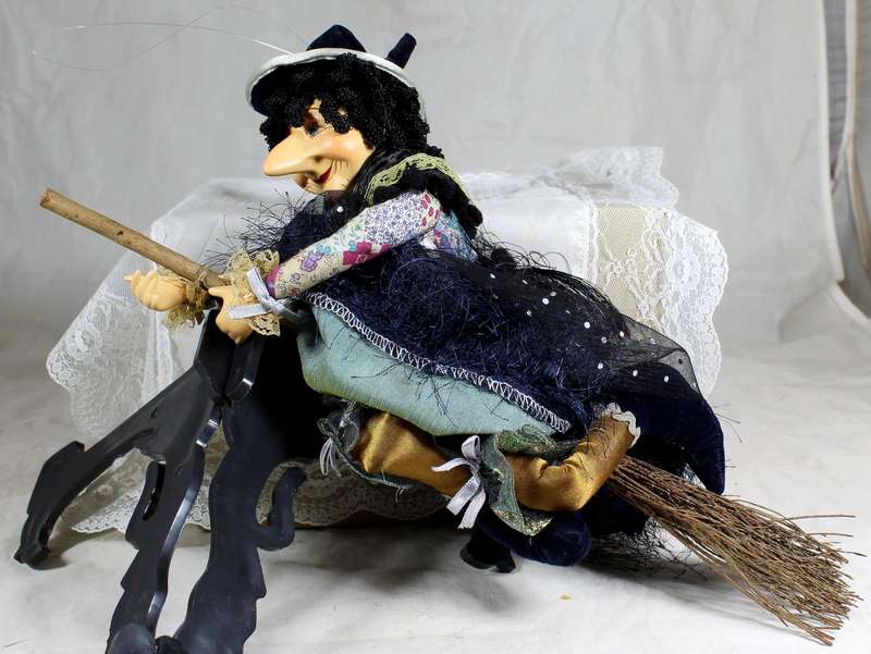 Large witch riding a broom
