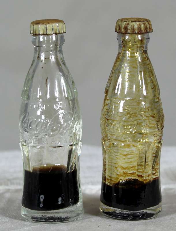 Pair of miniature Coca-Cola bottles
