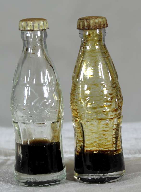 Pair of miniature Coca-Cola bottles