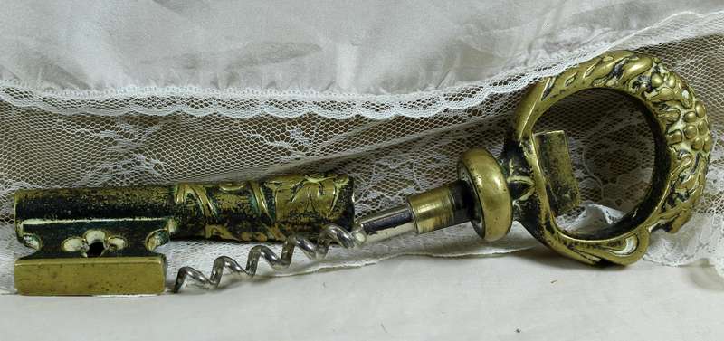 Key shaped brass bottle opener and corkscrew