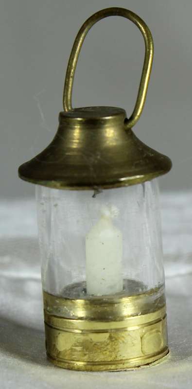 Miniature brass lamp with candle