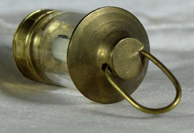 Miniature brass lamp with candle