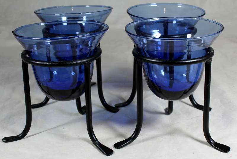 Set of four blue vases on stands