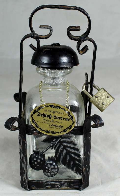 Metal Tantalus with bottle